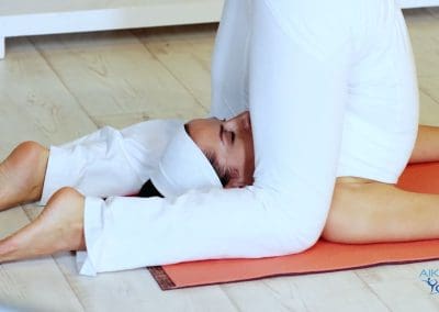 Karnapidasana is an advanced yoga pose that offers numerous benefits for the body and mind. Its Sanskrit name meaning "ear pressure pose," Karnapidasana involves gently folding the body into a fetal position with the knees close to the ears and the feet crossed behind the head.